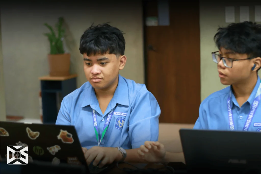 NU Fairview Students learning how to plot land parcels on their laptops
