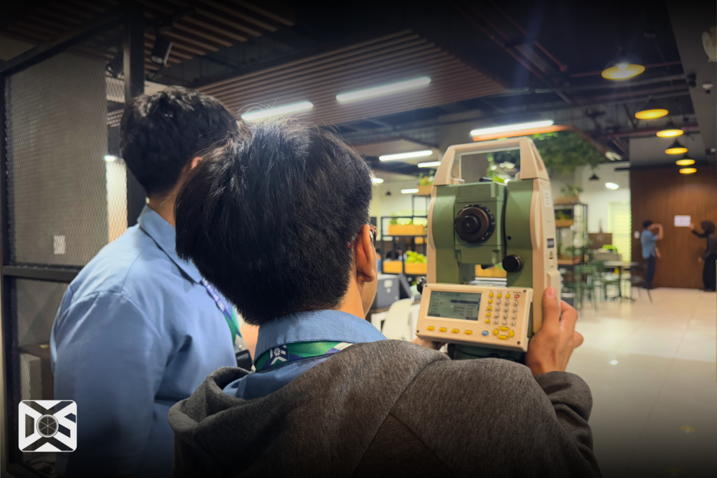 An NU Fairview SHS Student learns how to use the Total Station